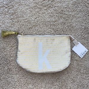 NWT monogram “K” makeup pouch with tassel on zipper